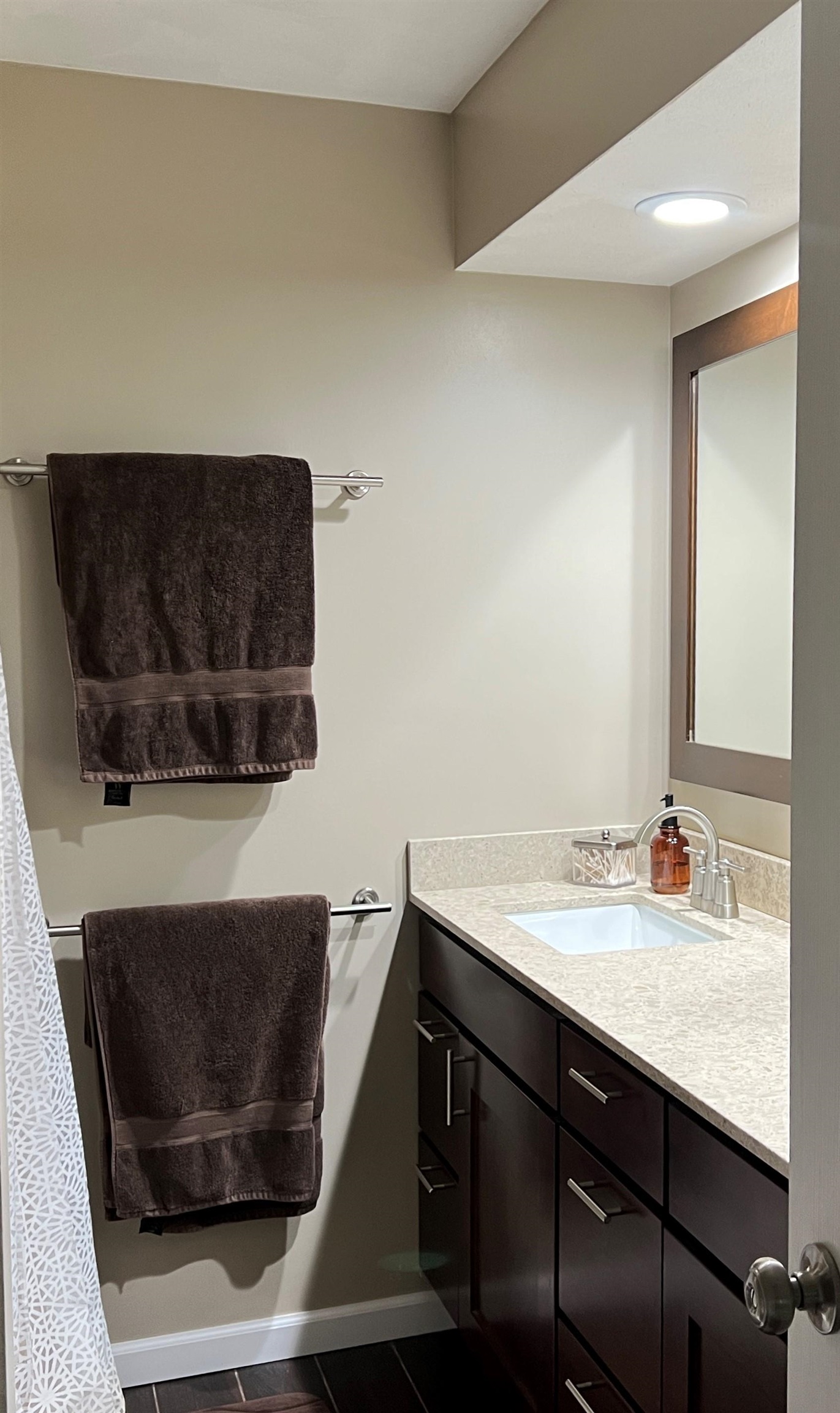 14 Spring Brook Road Rockford, IL 61114 - Photo 22 of 31 a living room with a sink and a mirror with wooden floor