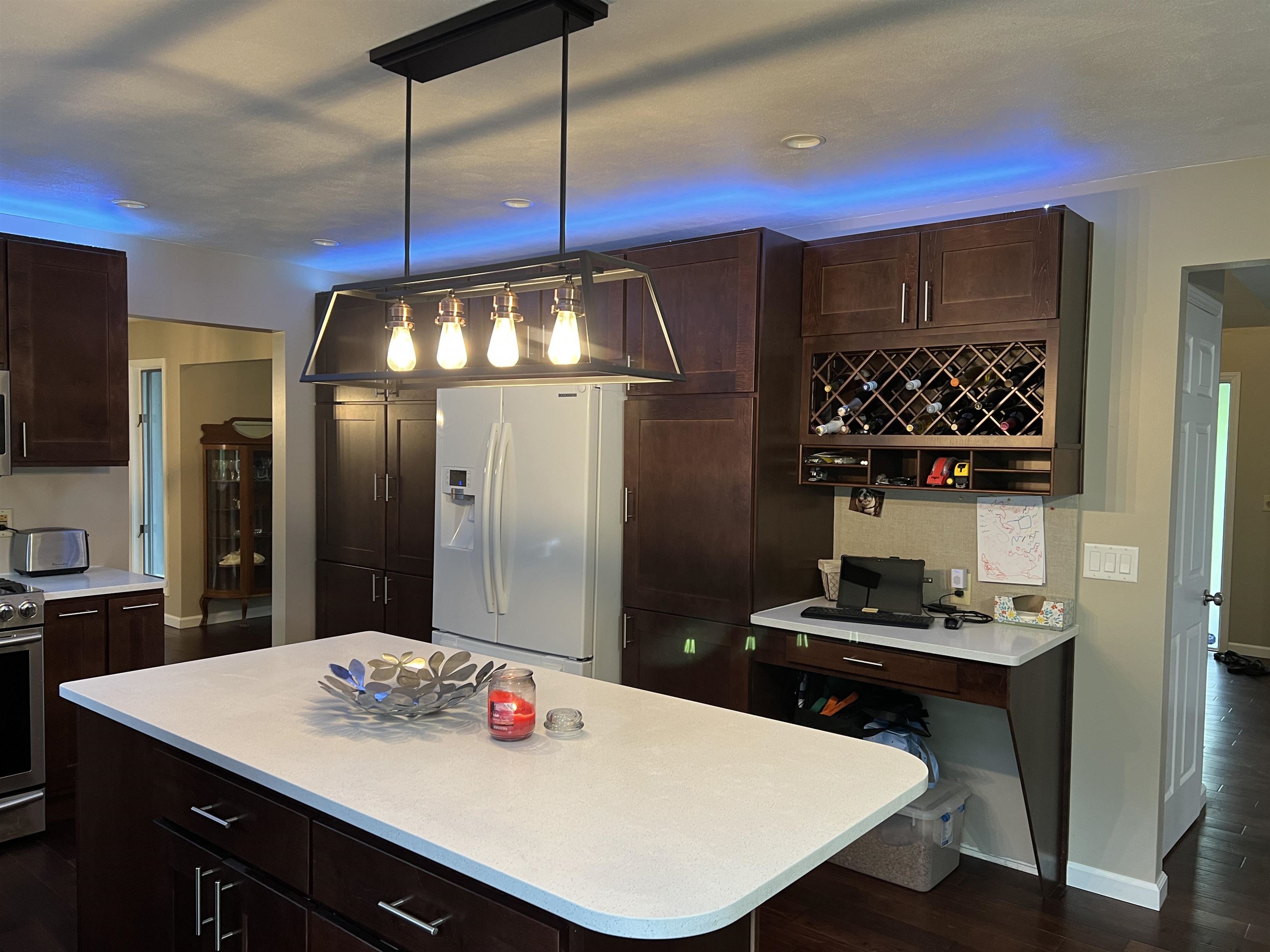 14 Spring Brook Road Rockford, IL 61114 - Photo 7 of 31 a kitchen with a table a refrigerator and cabinets