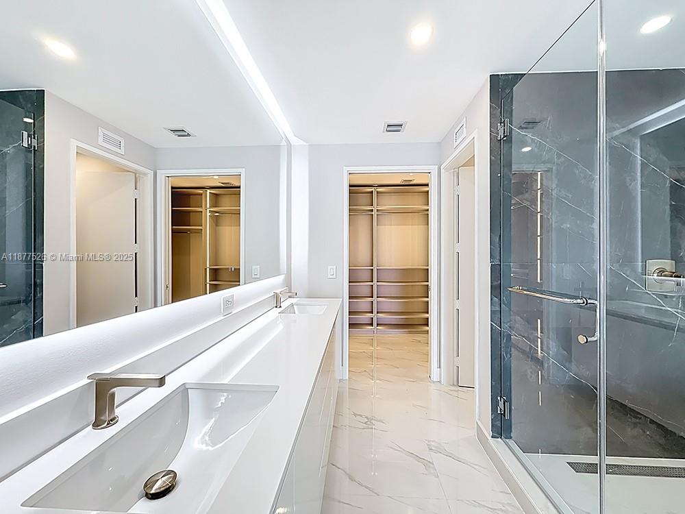 700 Northeast 24th Street, Unit 1402 Miami, FL 33137 - Photo 16 of 68 a spacious bathroom with a shower and a sink