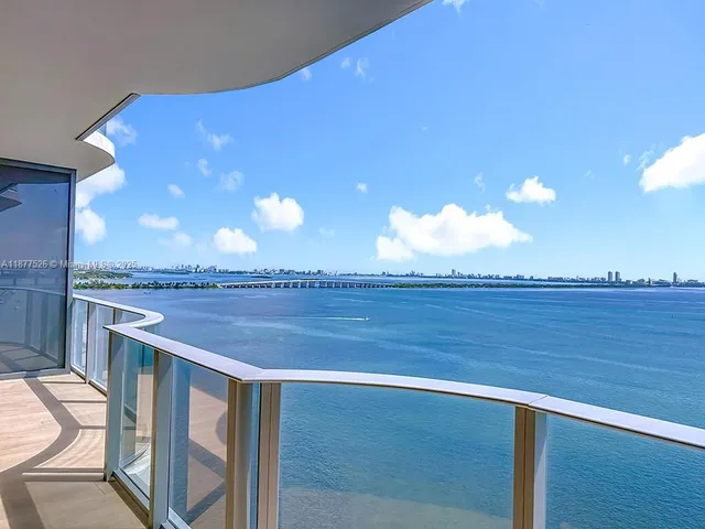 a bathroom with a sink a mirror and a shower