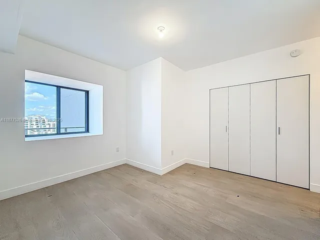 a view of a lake with tall building next to a lake