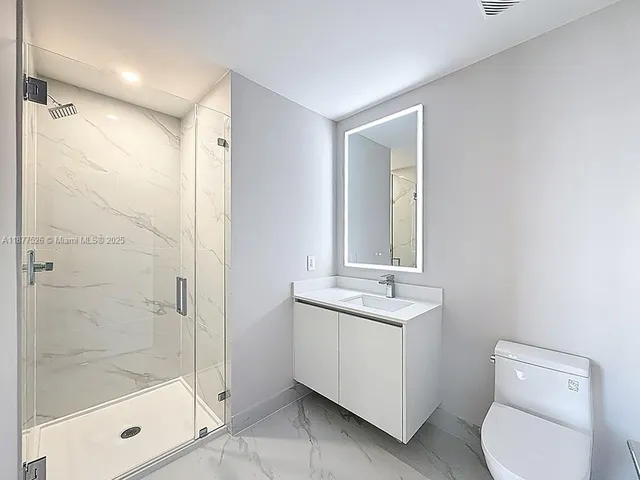 a swimming pool with outdoor seating and plants