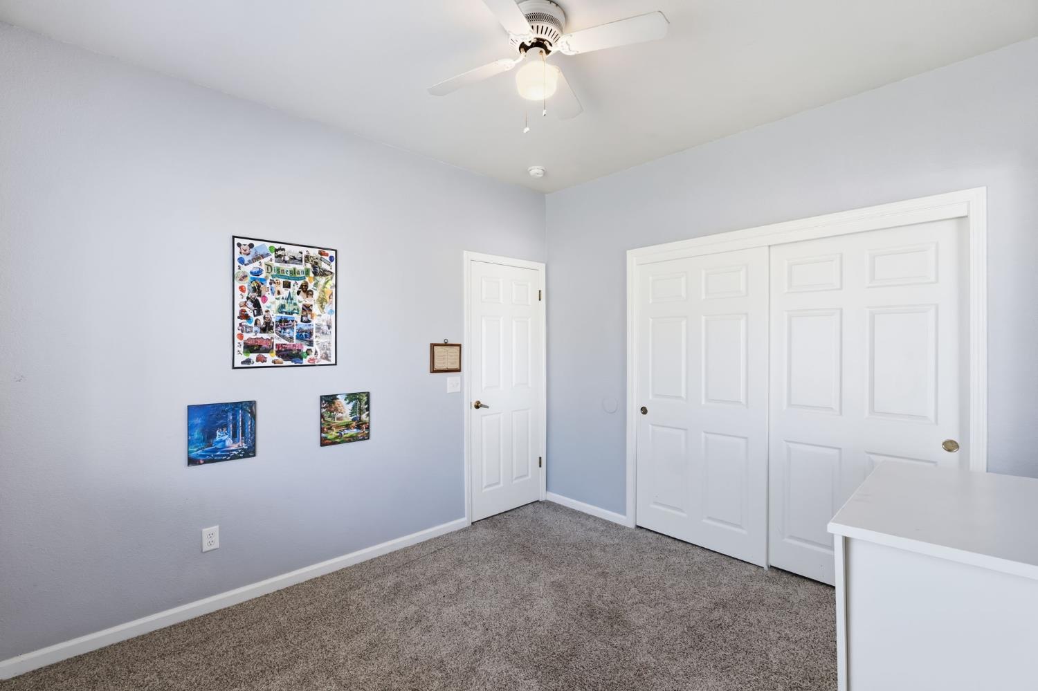 1757 Homestead Way Lemoore, CA 93245 - Photo 19 of 35 an empty room with fan and windows