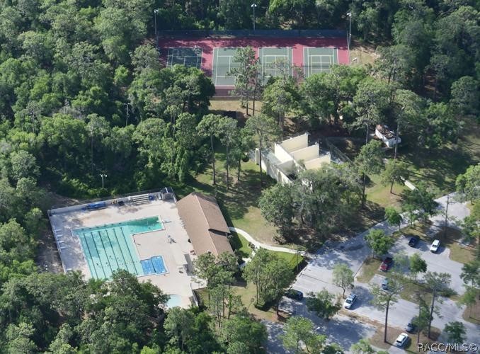 1140 South Highlands Avenue Inverness, FL 34452 - Photo 49 of 54 an aerial view of a house with yard and outdoor seating