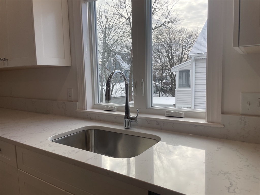 29 Crescent Road, Unit 29 Belmont, MA 02478 - Photo 9 of 21 a view closed with a sink and mirror