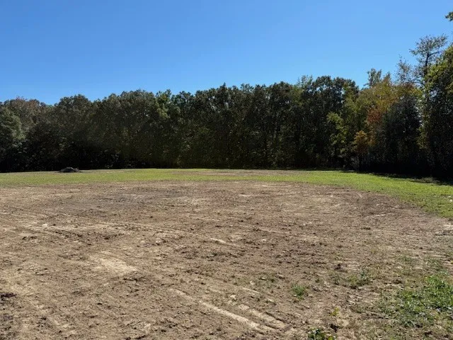 a view of open space with a lake view