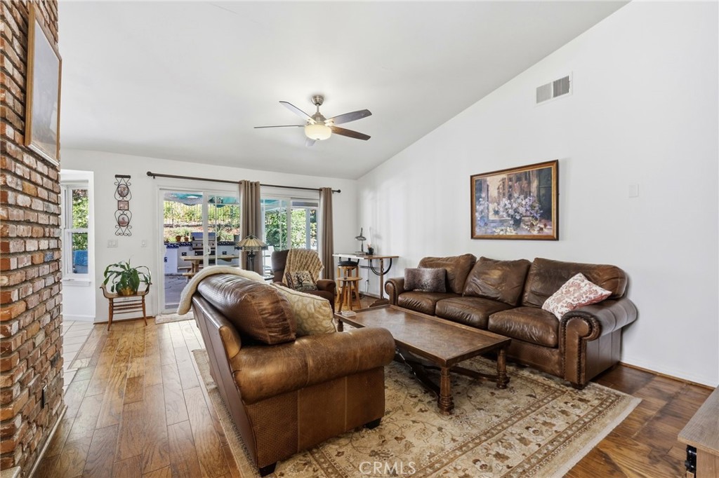 18233 Charlton Lane Porter Ranch, CA 91326 - Photo 30 of 40 a living room with furniture and a large window