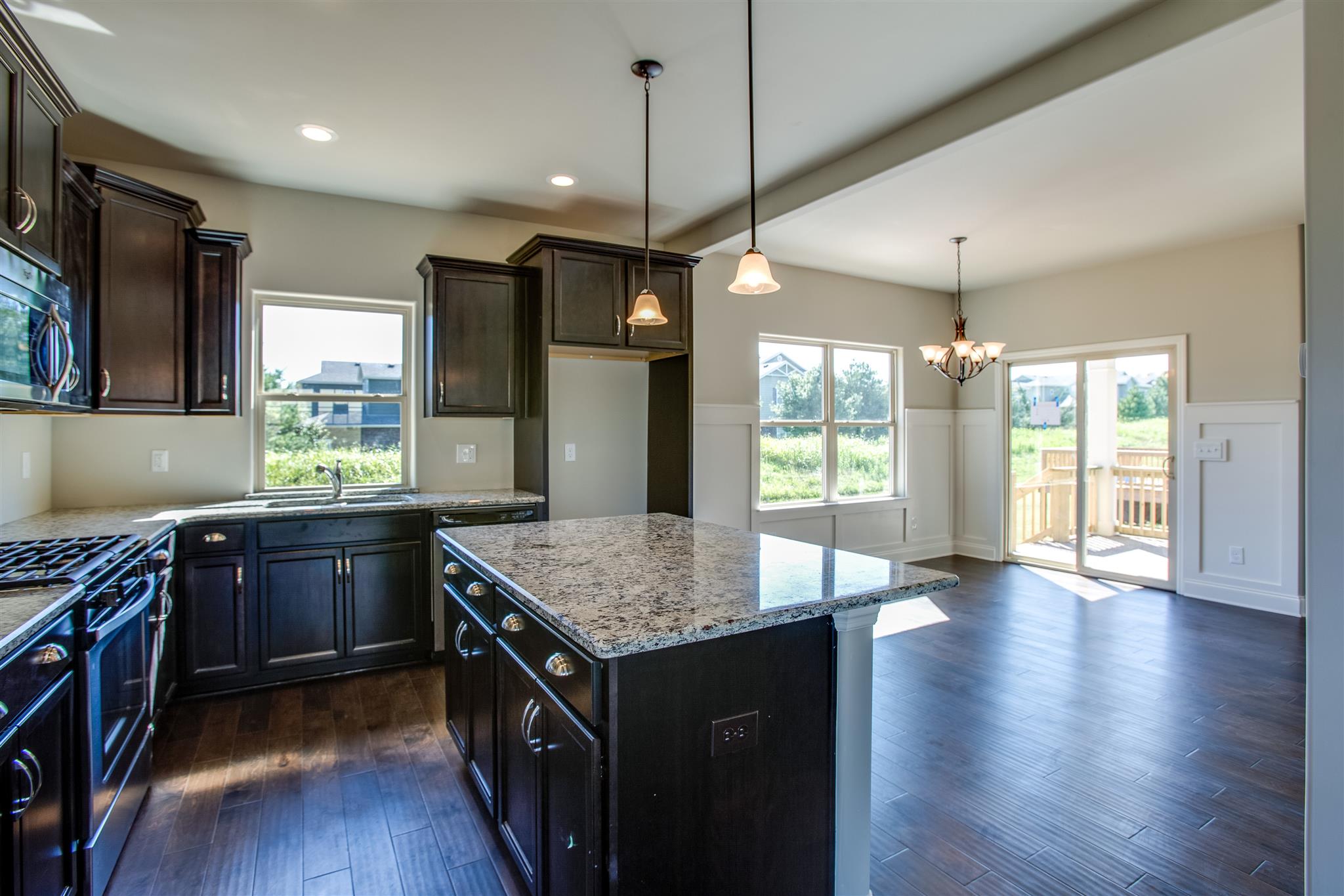 3013 Wesley Road Spring Hill, TN 37174 - Photo 9 of 23 Kitchen is open to the dining room which leads directly to the covered porch