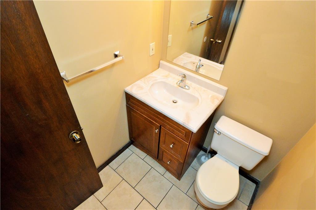 1023-1025 Moon Run Road McKees Rocks, PA 15136 - Photo 11 of 25 a bathroom with a sink toilet and mirror