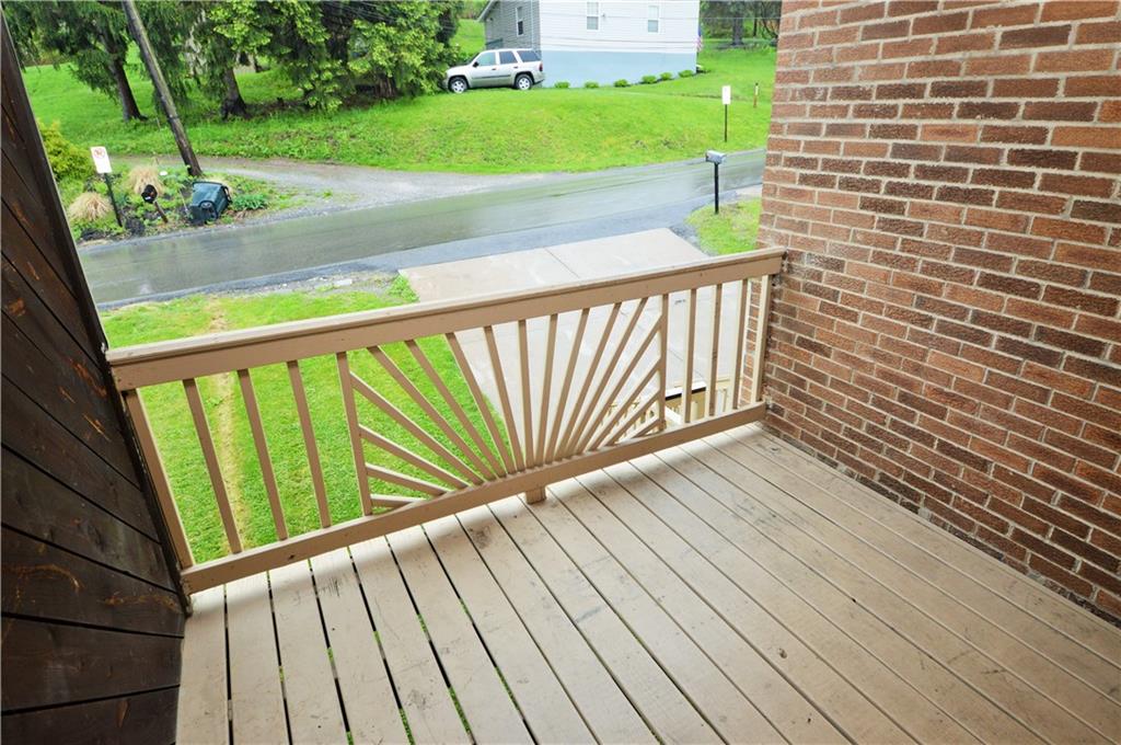 1023-1025 Moon Run Road McKees Rocks, PA 15136 - Photo 23 of 25 a view of a balcony with wooden floor