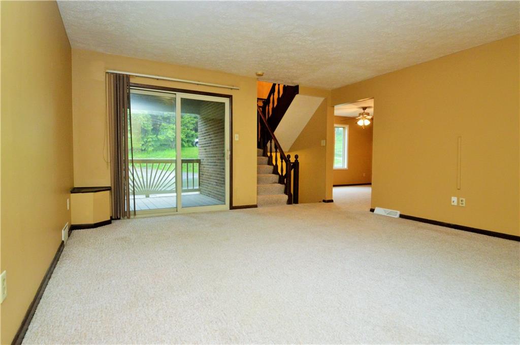 1023-1025 Moon Run Road McKees Rocks, PA 15136 - Photo 3 of 25 a view of a livingroom with a staircase