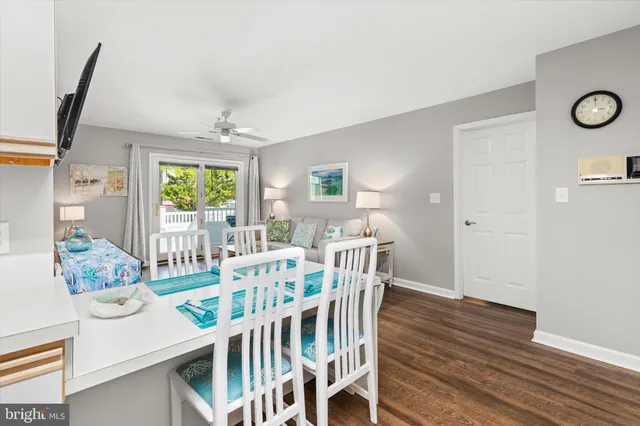 a view of a dining room with furniture and window