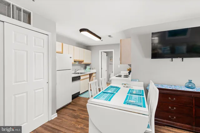 a room with furniture and a flat screen tv