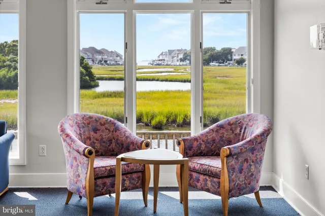a dining room with furniture and a book shelf