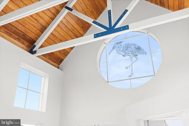 a view of a dining room with furniture wooden floor and chandelier