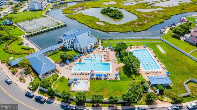 an aerial view of a house with a swimming pool yard and outdoor seating
