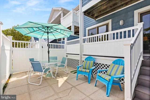 a view of a chair and table in the balcony
