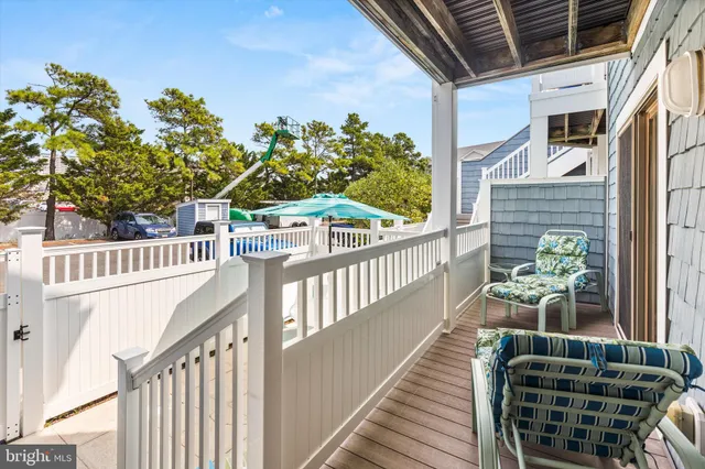 a view of a balcony with chairs