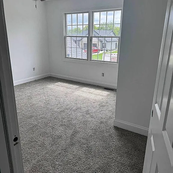 1713 Bob O Link Street Pontiac, IL 61764 - Photo 12 of 17 an empty room with a empty space and windows