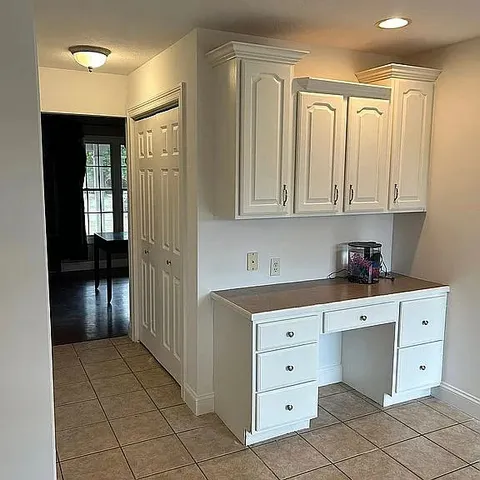 a kitchen with stainless steel appliances a stove and more cabinets