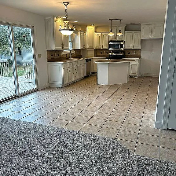1713 Bob O Link Street Pontiac, IL 61764 - Photo 5 of 17 a kitchen with stainless steel appliances a sink stove and cabinets