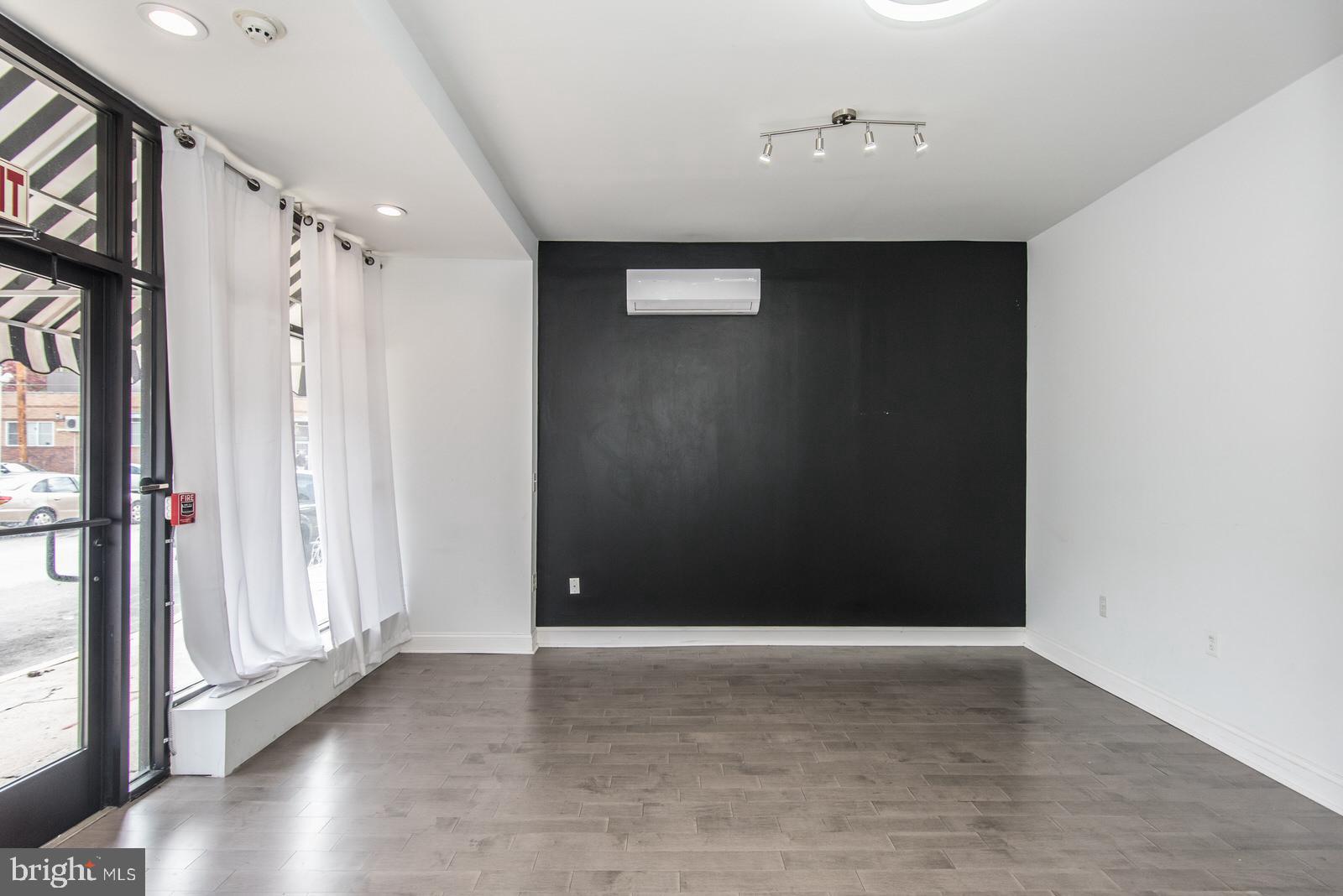 2578 Orthodox Street Philadelphia, PA 19137 - Photo 11 of 62 a view of an empty room with wooden floor and a window