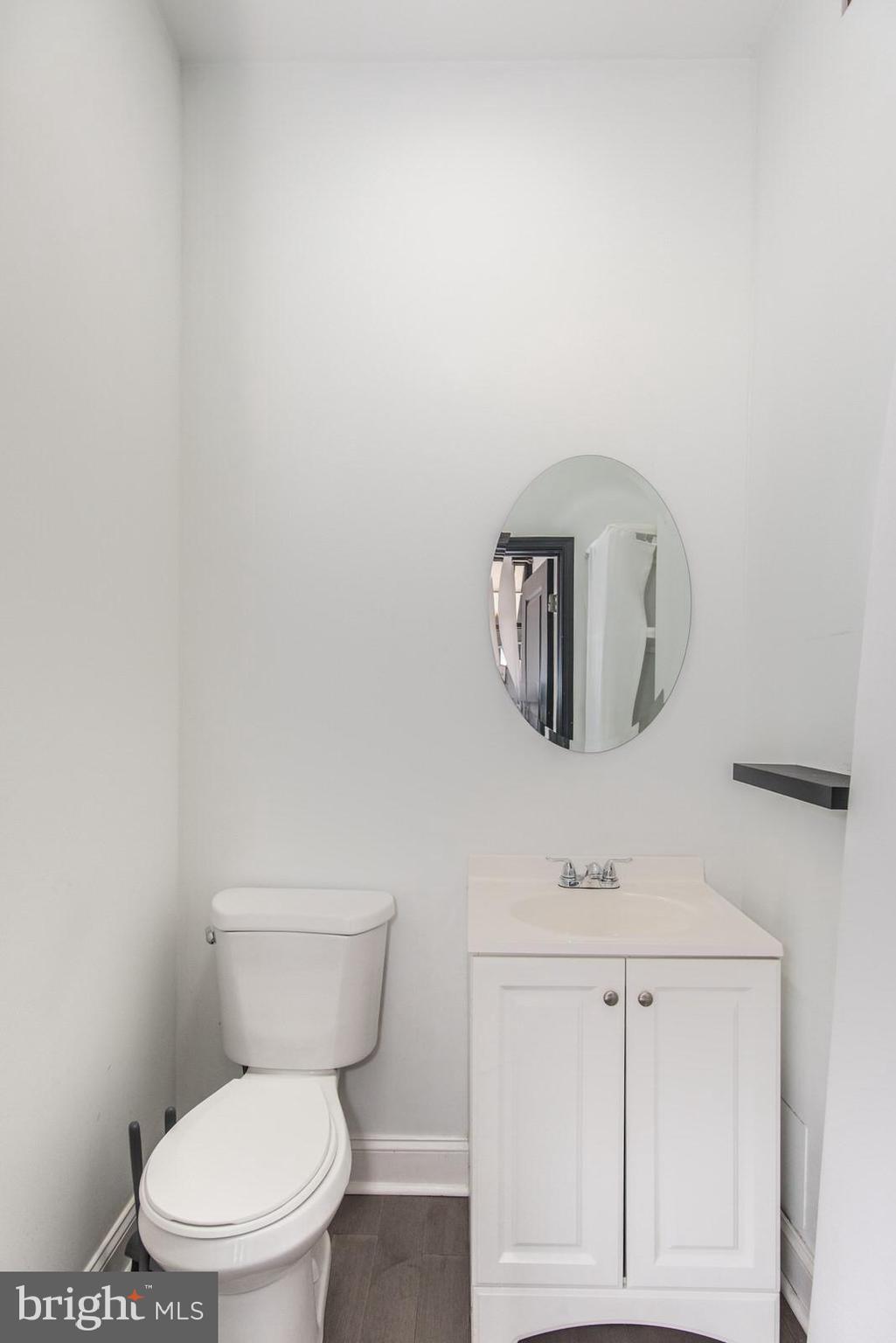 2578 Orthodox Street Philadelphia, PA 19137 - Photo 17 of 62 a white toilet sitting next to a bathroom sink