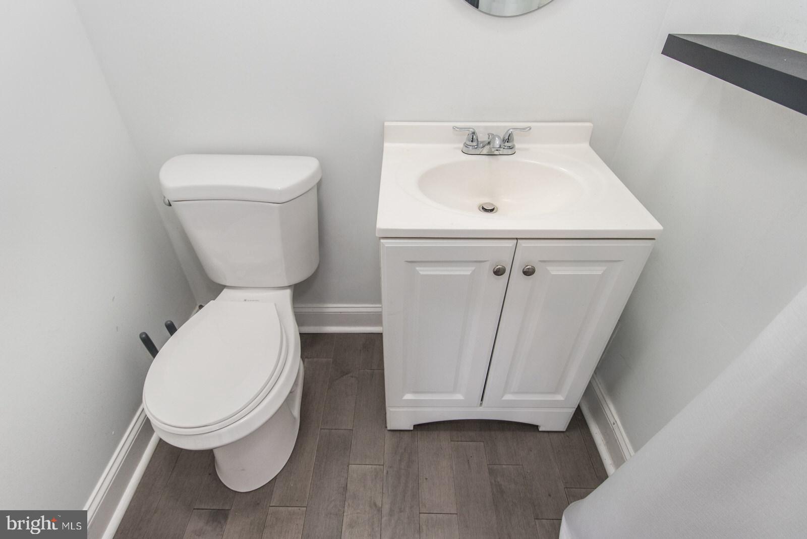 2578 Orthodox Street Philadelphia, PA 19137 - Photo 18 of 62 a white toilet sitting next to a bathroom sink