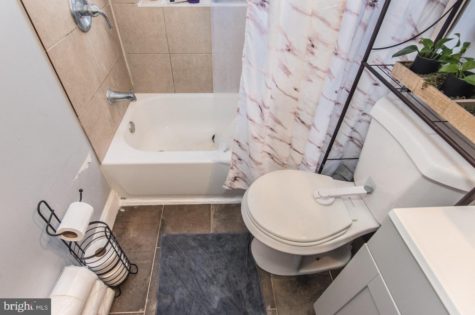 2578 Orthodox Street Philadelphia, PA 19137 - Photo 24 of 62 a bathroom with a toilet and a bathtub
