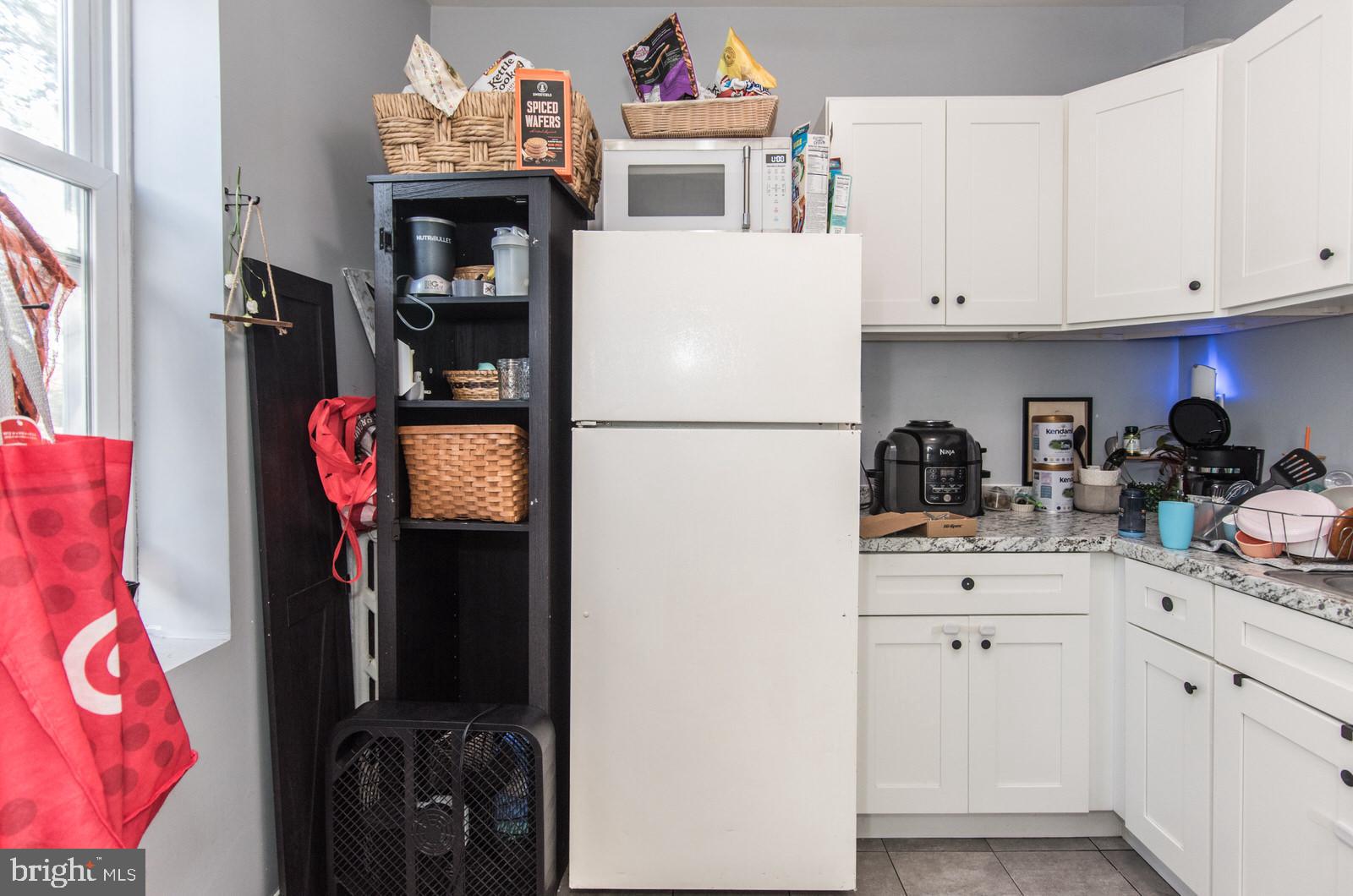 2578 Orthodox Street Philadelphia, PA 19137 - Photo 28 of 62 a white refrigerator freezer sitting inside of a kitchen