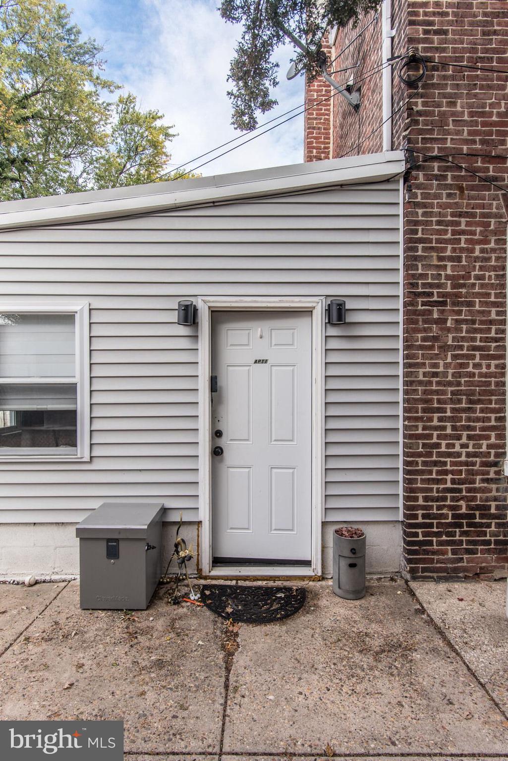 2578 Orthodox Street Philadelphia, PA 19137 - Photo 38 of 62 a view of a house with a door and wooden bench