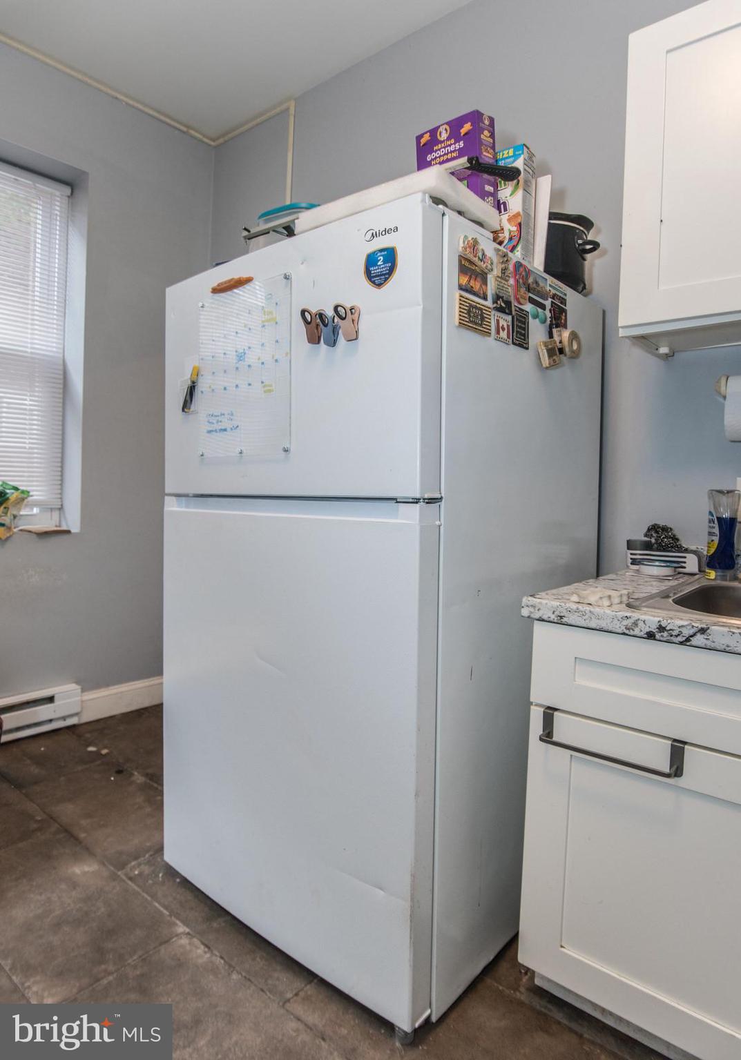 2578 Orthodox Street Philadelphia, PA 19137 - Photo 44 of 62 a white refrigerator freezer sitting inside of a kitchen