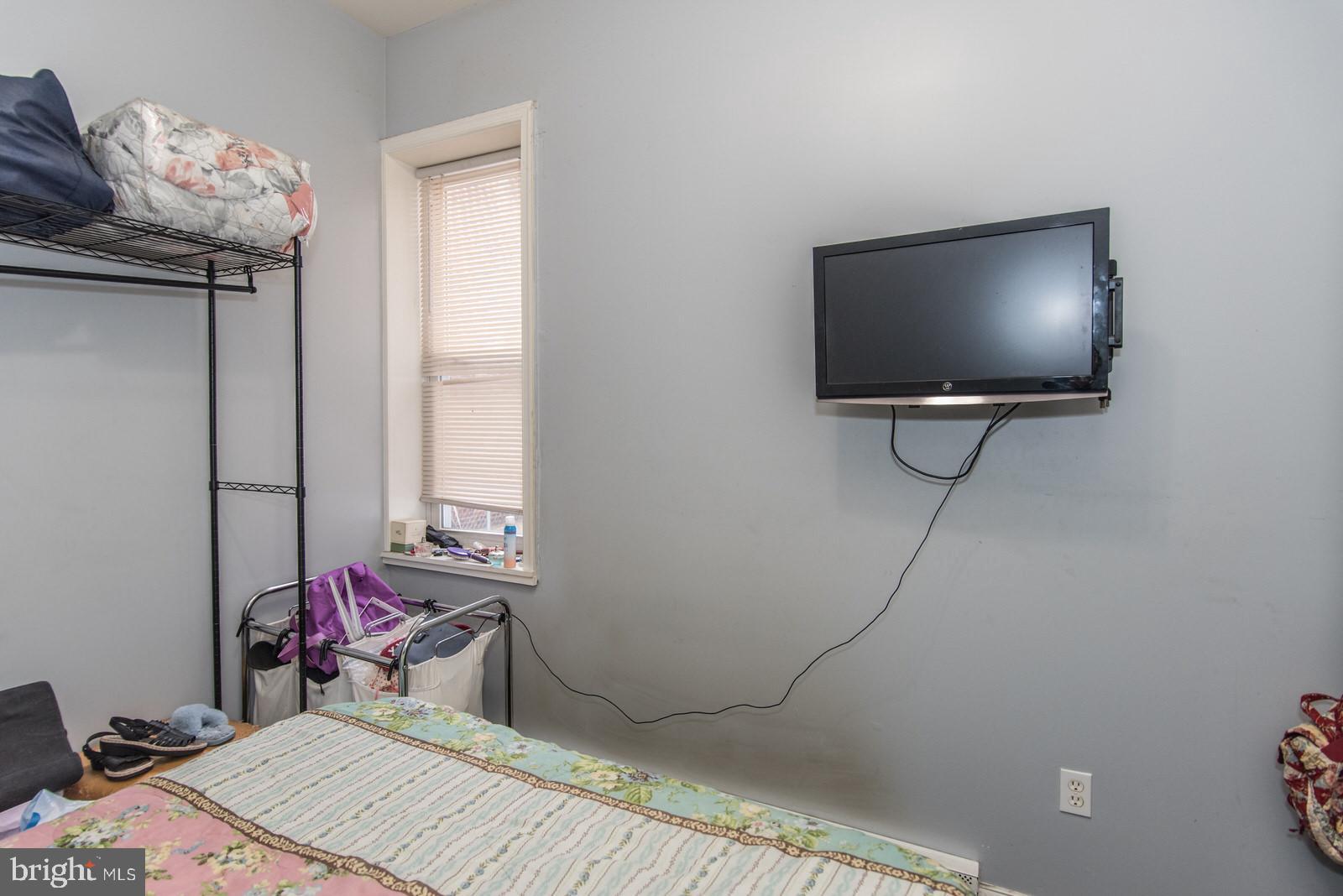 2578 Orthodox Street Philadelphia, PA 19137 - Photo 47 of 62 a bedroom with a bed and a flat screen tv