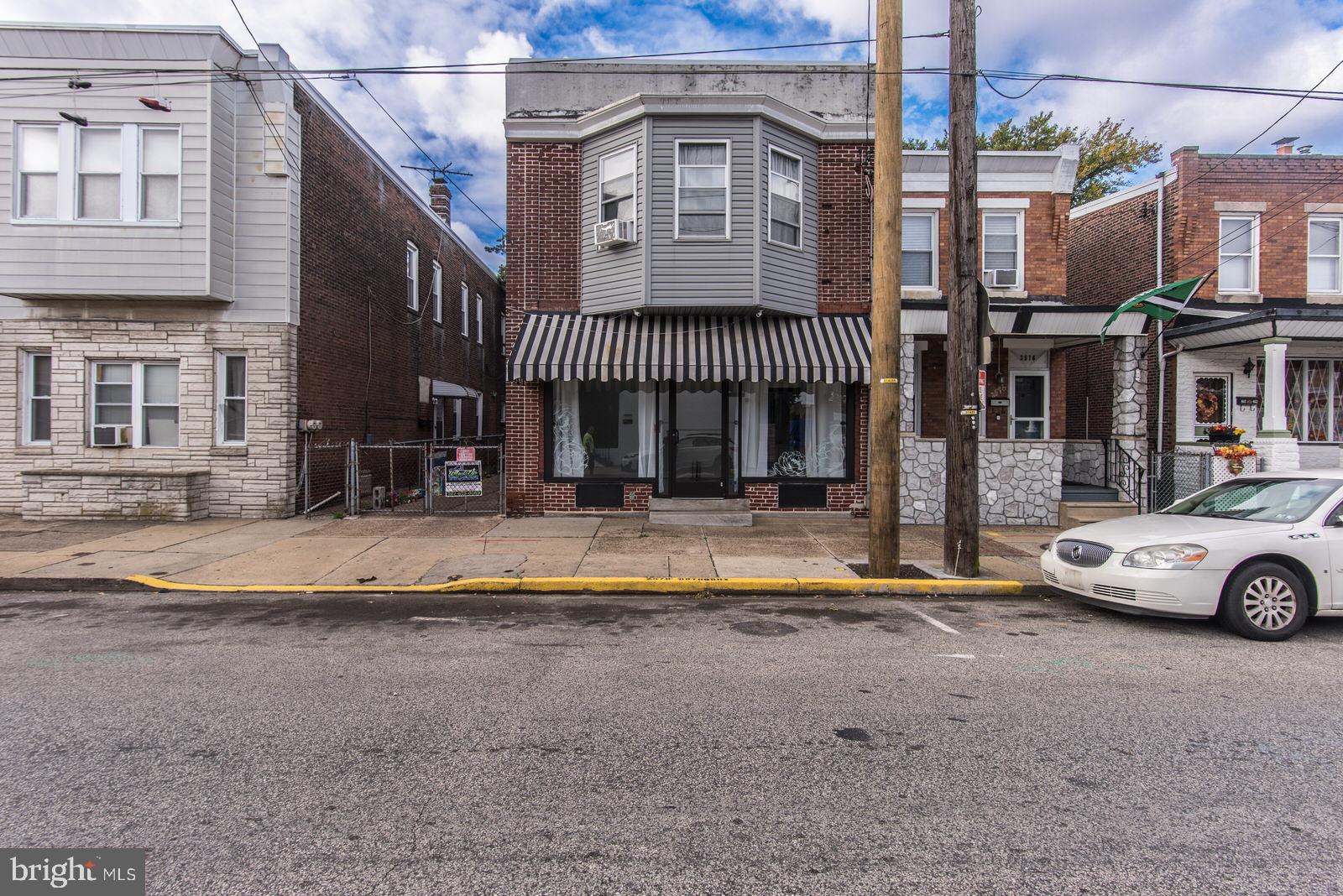 2578 Orthodox Street Philadelphia, PA 19137 - Photo 6 of 62 a front view of a building with retail shops