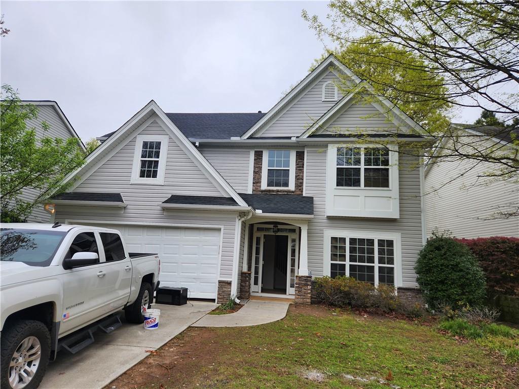 181 Diamond Ridge Avenue Canton, GA 30114 - Photo 1 of 1 a front view of a house with a yard
