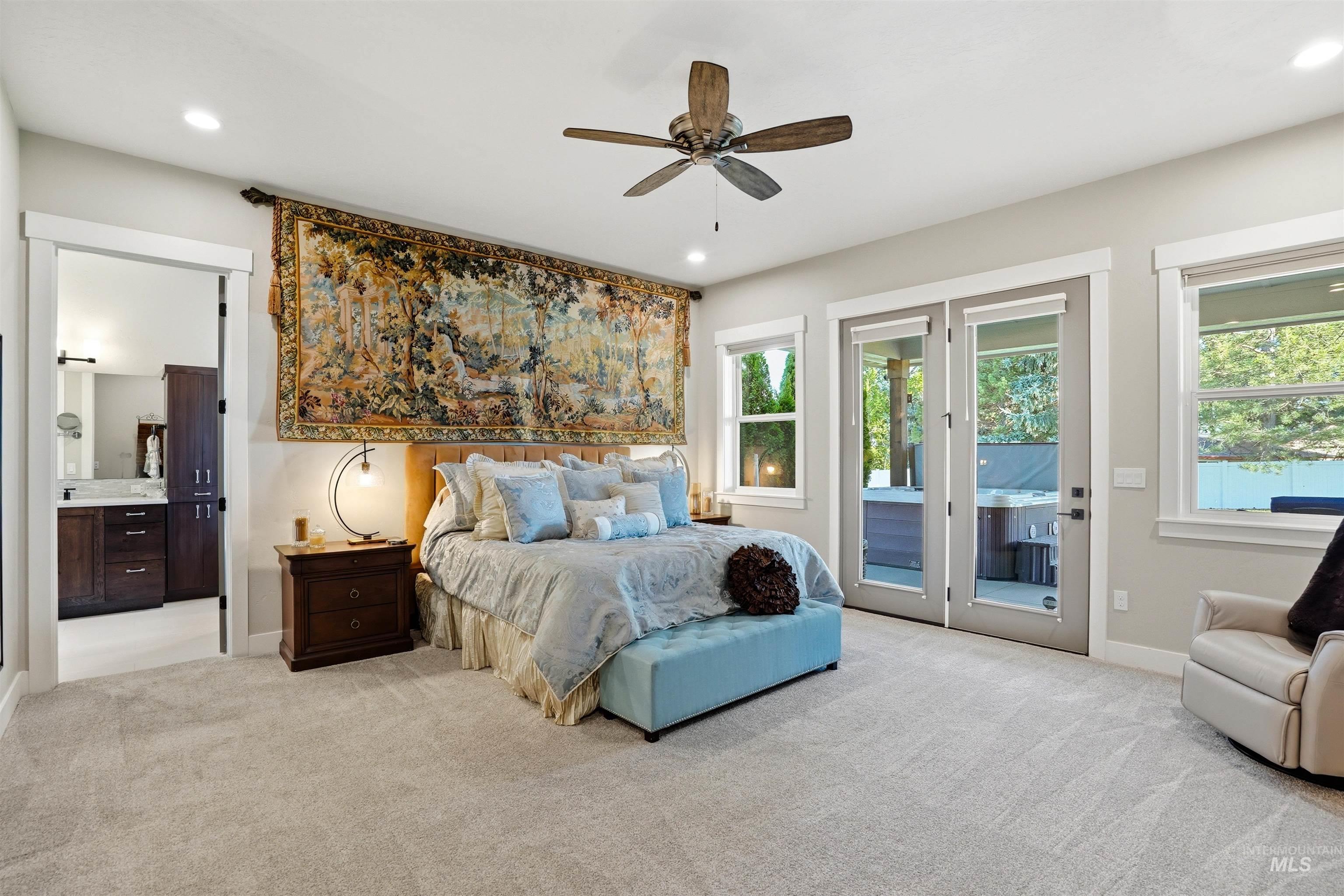 24165 Boer Goat Avenue Caldwell, ID 83607 - Photo 19 of 34 Spacious room featuring light-toned carpet flooring, a ceiling fan with integrated lighting, and multiple windows