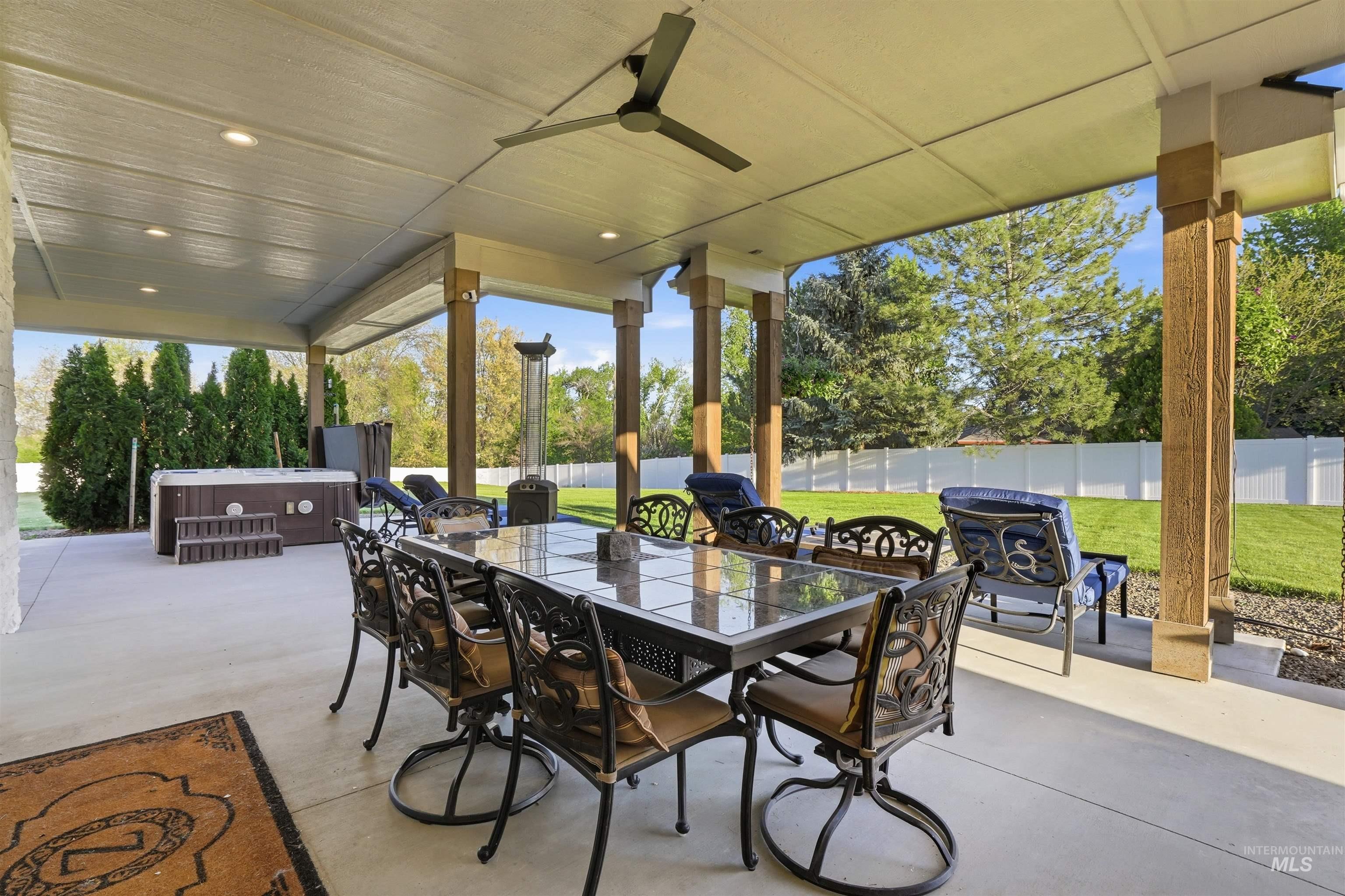 24165 Boer Goat Avenue Caldwell, ID 83607 - Photo 27 of 34 Covered outdoor patio with a ceiling fan, recessed lighting, and support columns