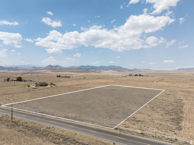 2252 South Brooklyn Road Monroe, UT 84754 - Photo 1 of 6 Expansive land parcel featuring direct road frontage, a flat topography, and distant mountain backdrops