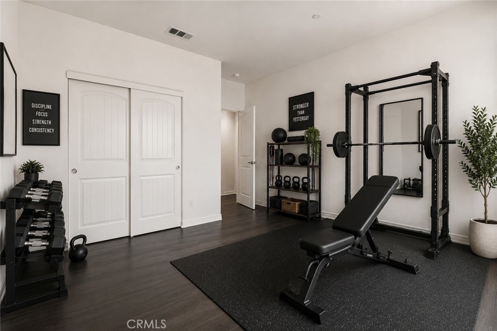 11056 Guffey Ranch Way Corona, CA 92883 - Photo 22 of 61 a view of a workspace with furniture and gym equipment
