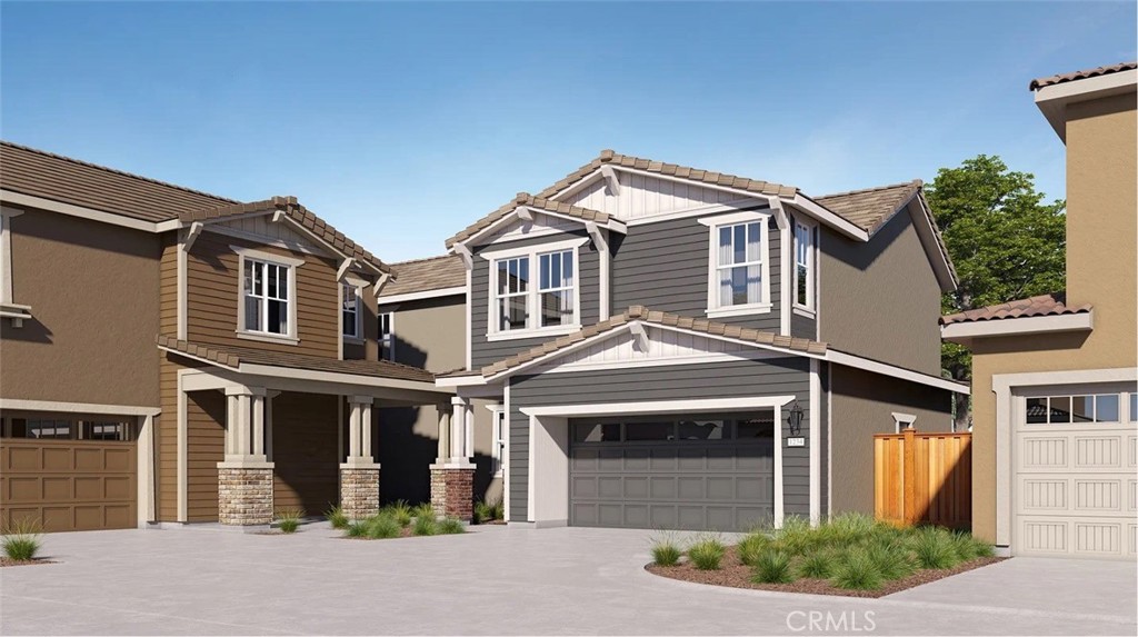 1707 Eagle Road Rialto, CA 92376 - Photo 16 of 18 a front view of a house with a yard and garage