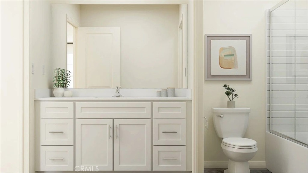1707 Eagle Road Rialto, CA 92376 - Photo 7 of 18 a bathroom with a toilet sink and mirror