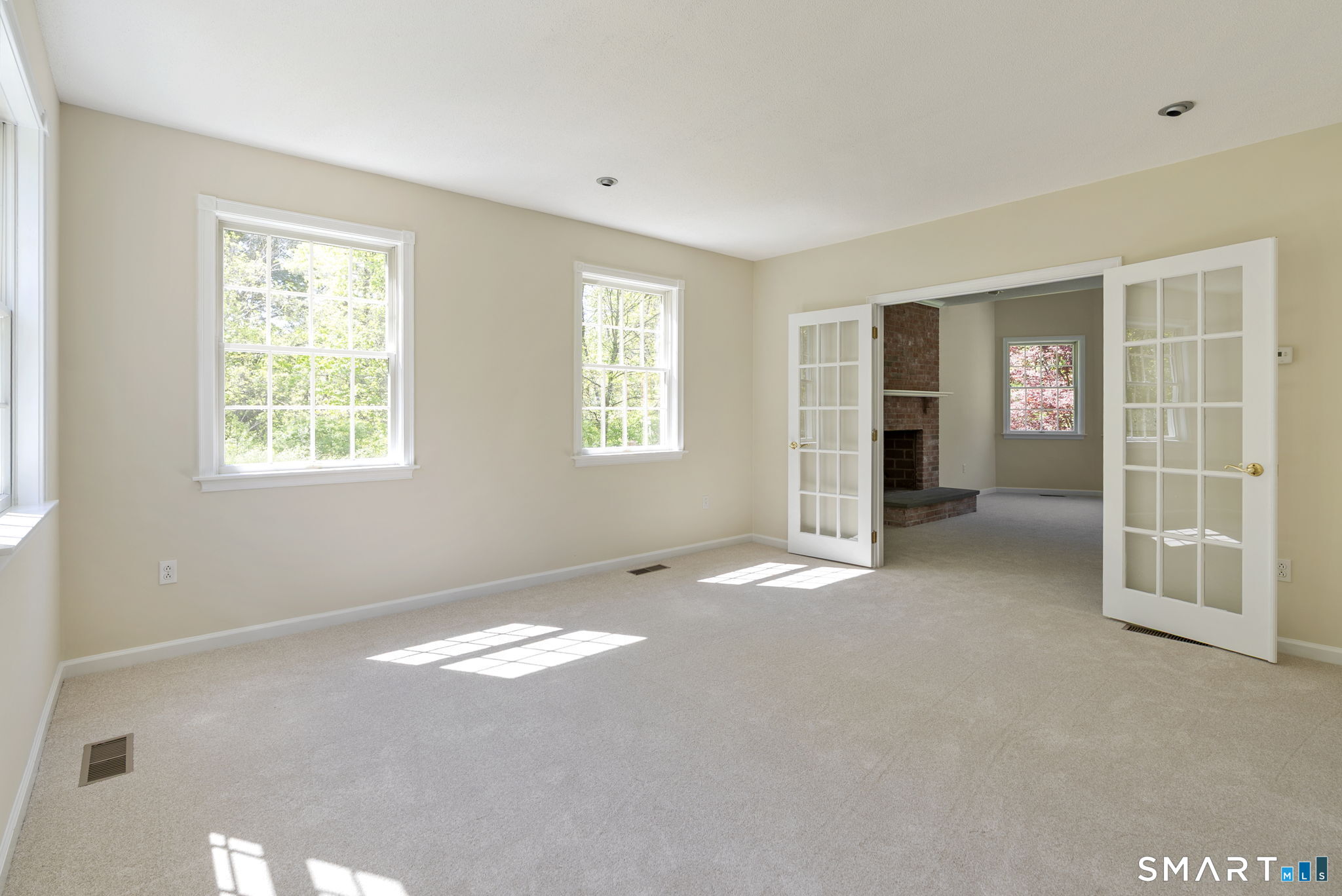 555 Waterville Road Avon, CT 06001 - Photo 20 of 40 a view of an empty room with a window