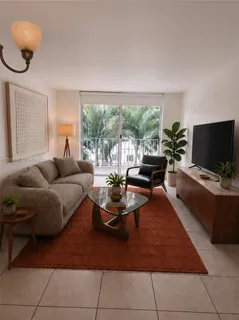 a view of an empty room with a floor to ceiling window and an empty room