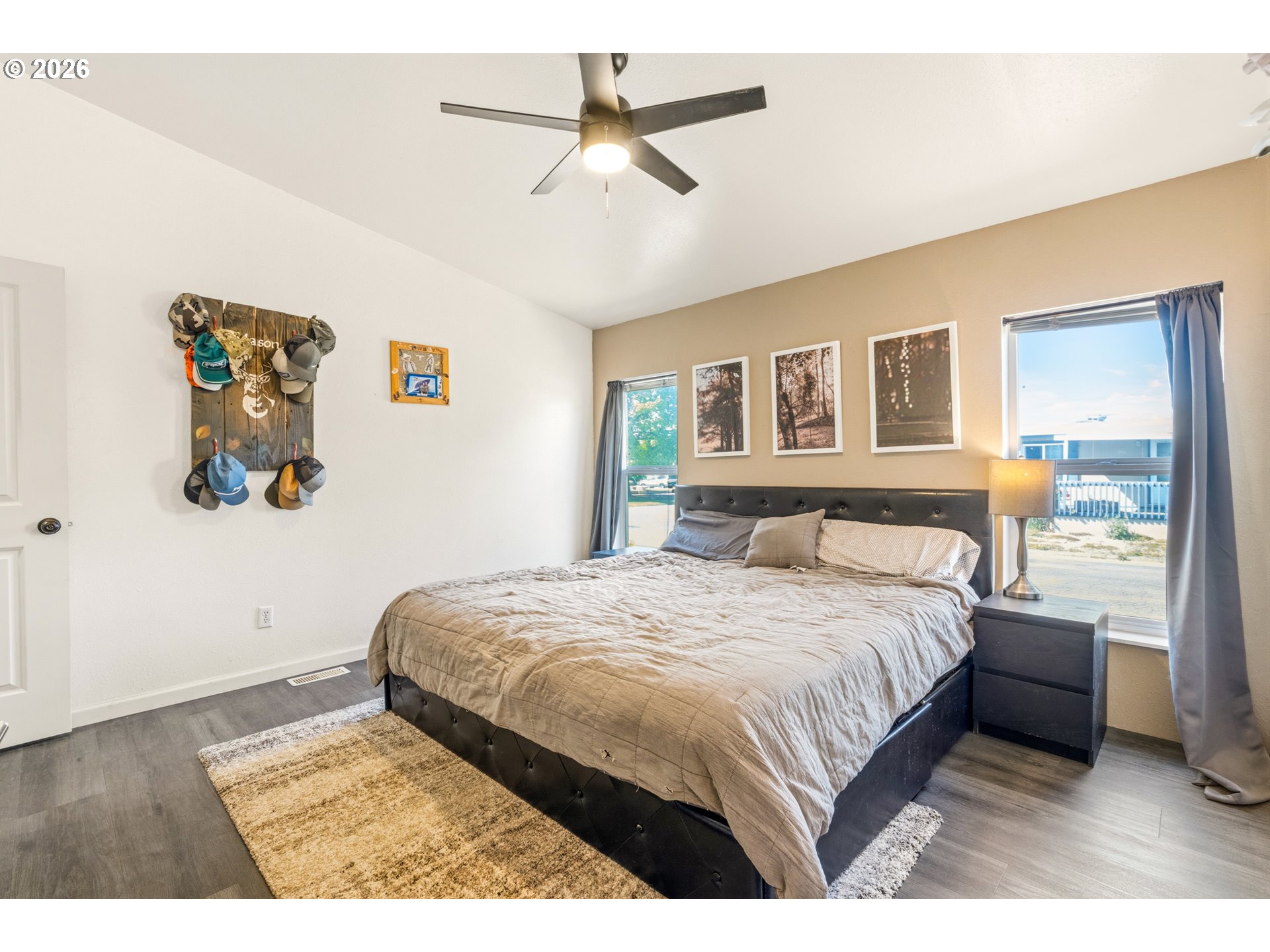 2151 Three Lakes Road Southeast Albany, OR 97322 - Photo 19 of 25 a bedroom with a large bed and a ceiling fan