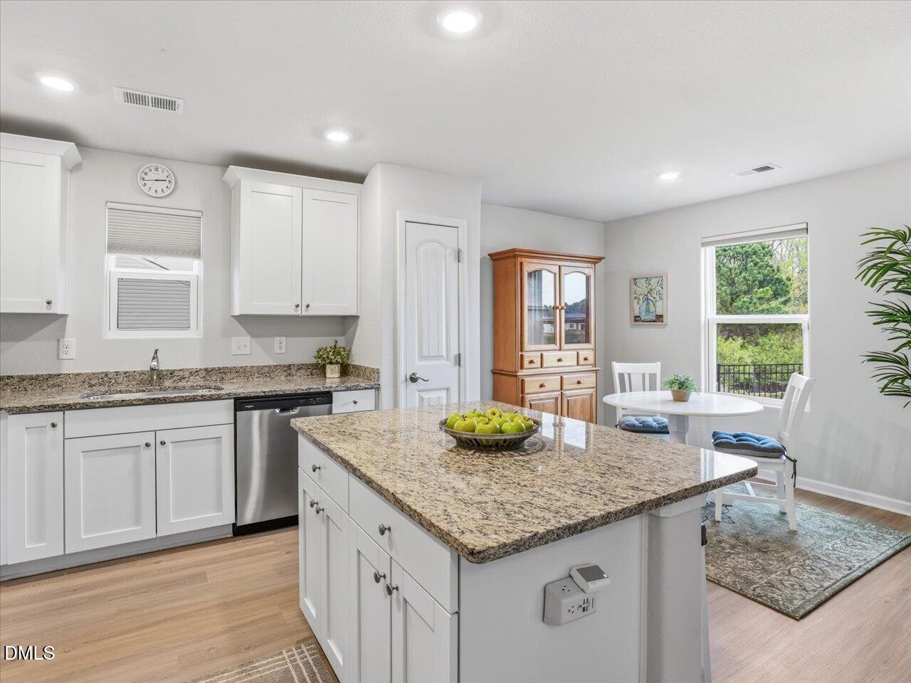90 Barnsley Road Angier, NC 27501 - Photo 12 of 40 a kitchen with granite countertop kitchen island sink and a granite counter tops