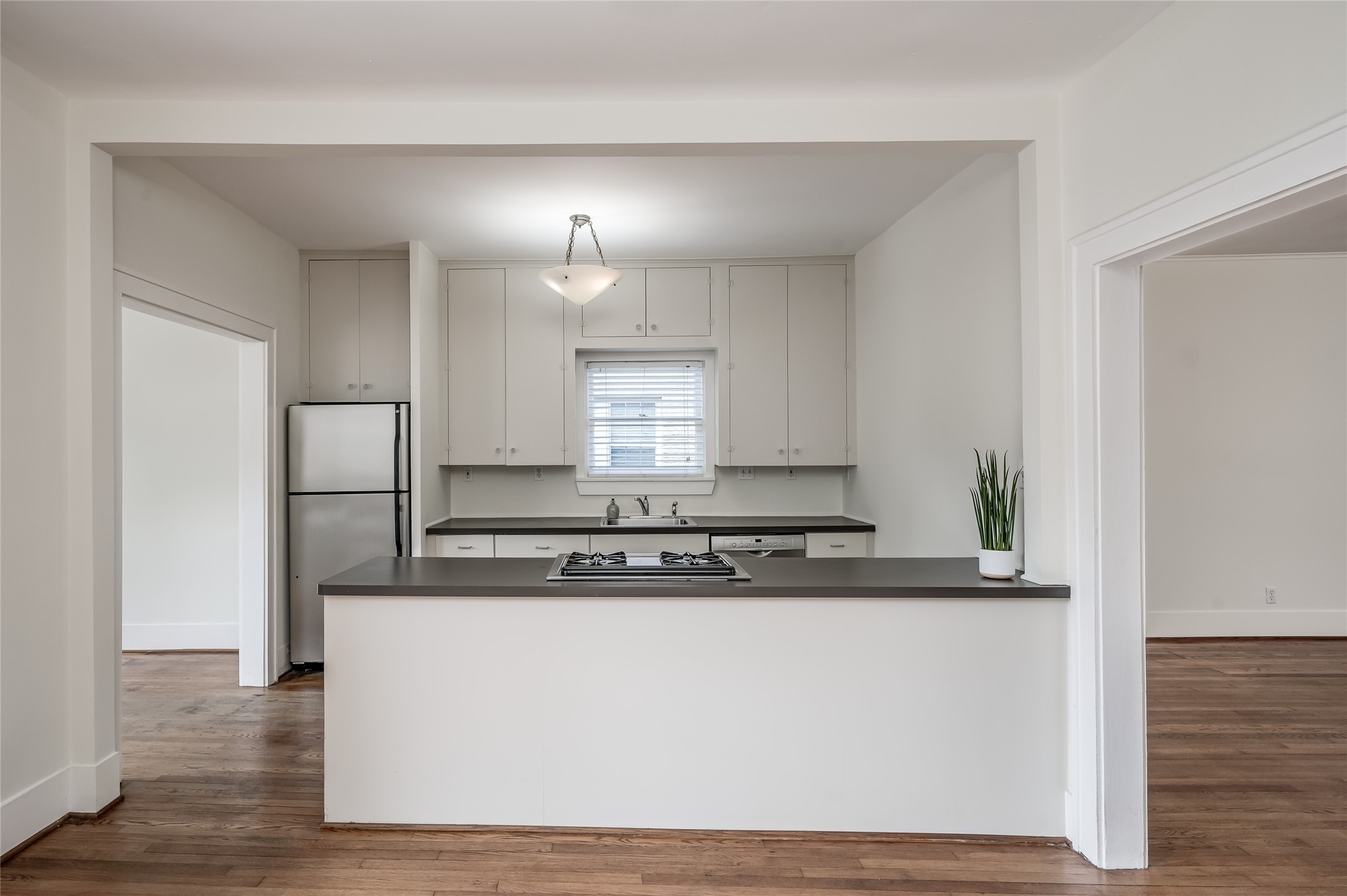 1737 Albans Road, Unit 1 Houston, TX 77005 - Photo 11 of 20 a view of a kitchen counter space and wooden floor