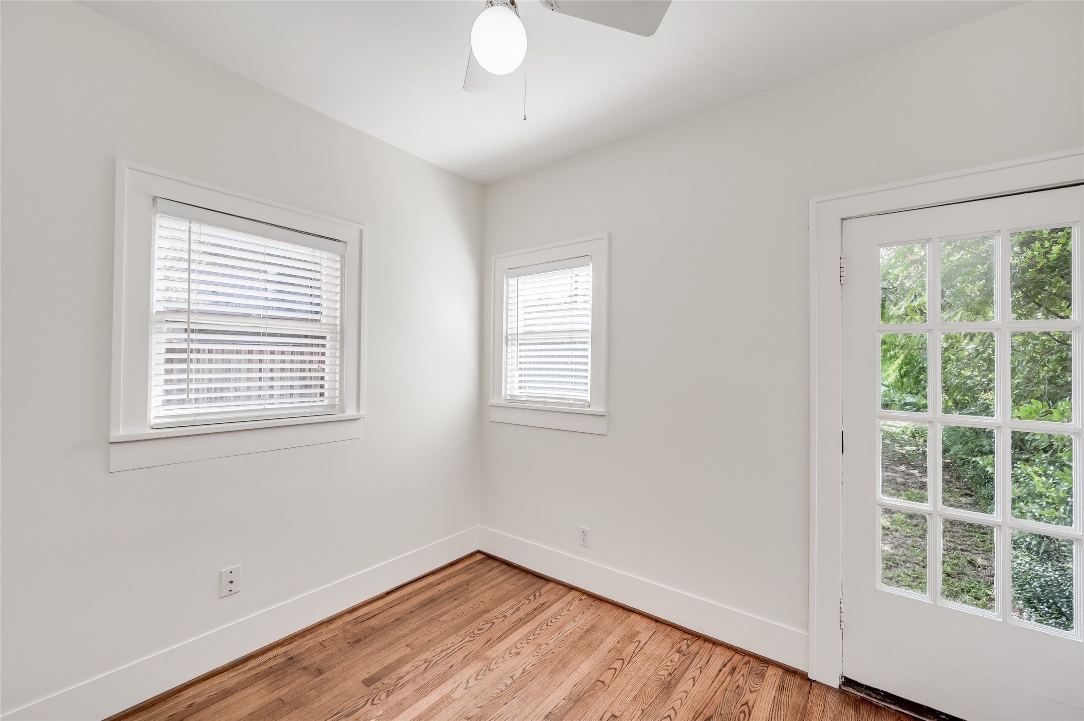 1737 Albans Road, Unit 1 Houston, TX 77005 - Photo 13 of 20 a view of an empty room with wooden floor and a window
