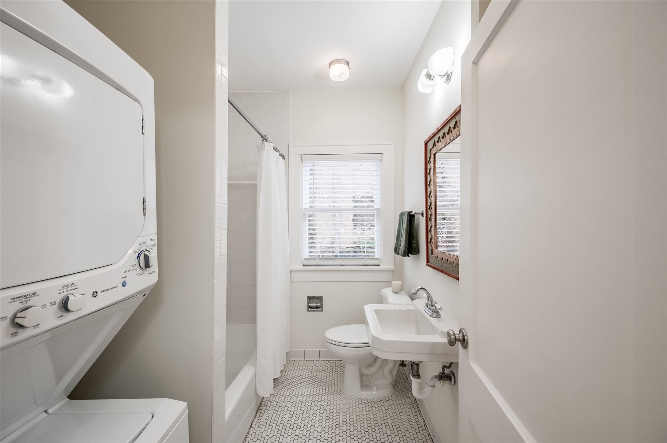 1737 Albans Road, Unit 1 Houston, TX 77005 - Photo 14 of 20 a bathroom with a sink a toilet a mirror and shower