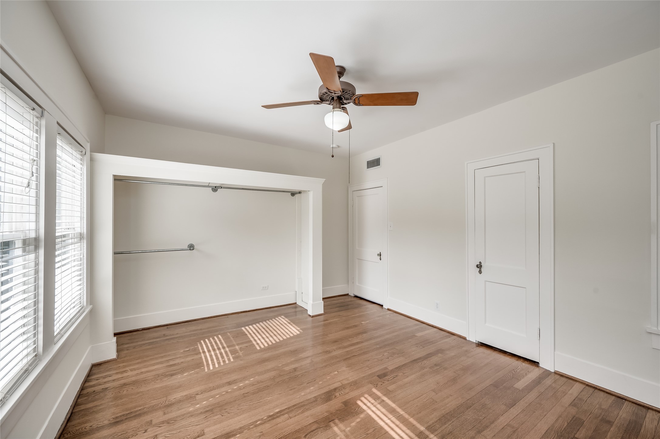 1737 Albans Road, Unit 1 Houston, TX 77005 - Photo 16 of 20 wooden floor in an empty room with a window