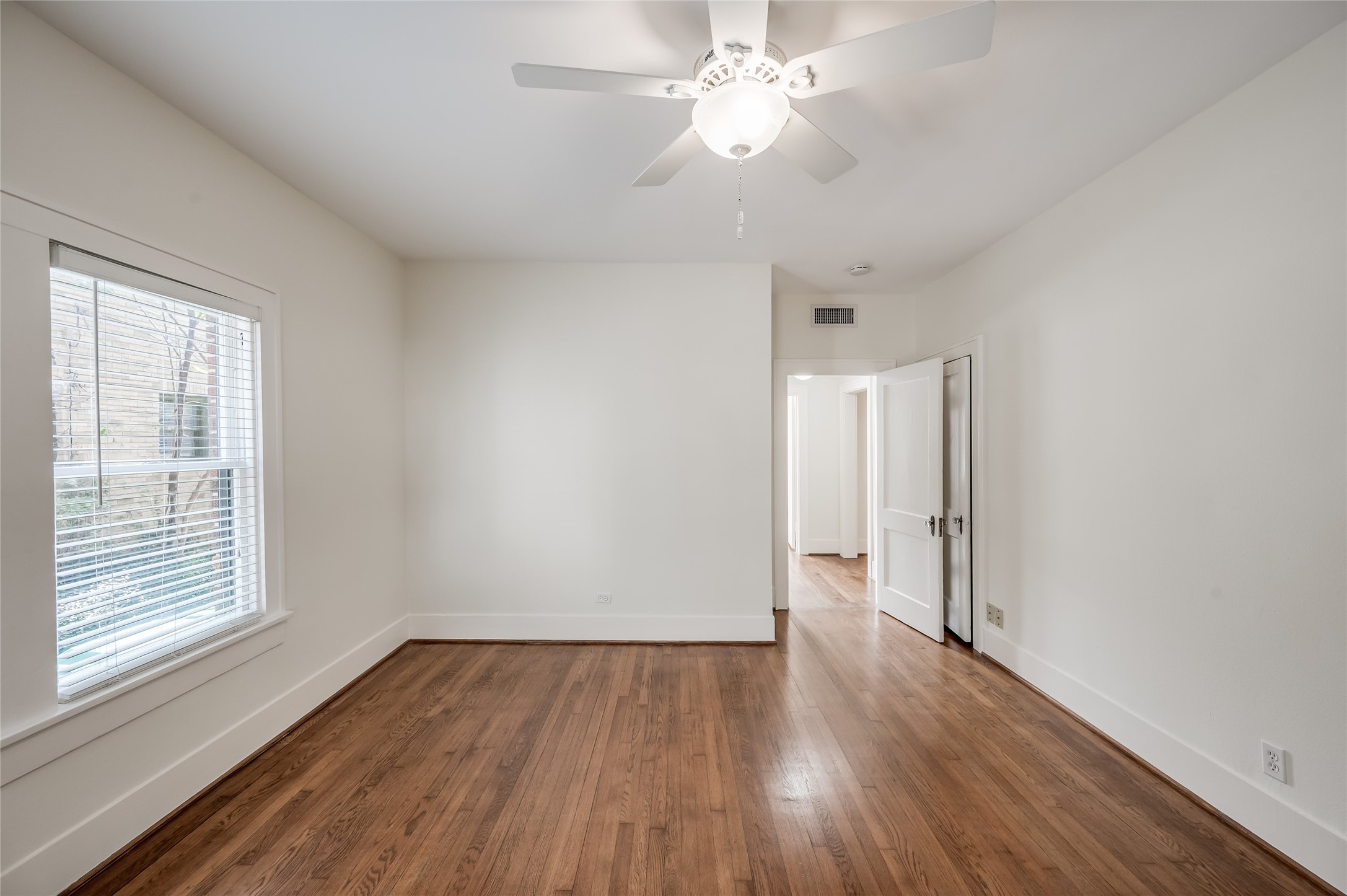 1737 Albans Road, Unit 1 Houston, TX 77005 - Photo 18 of 20 wooden floor in an empty room with a window